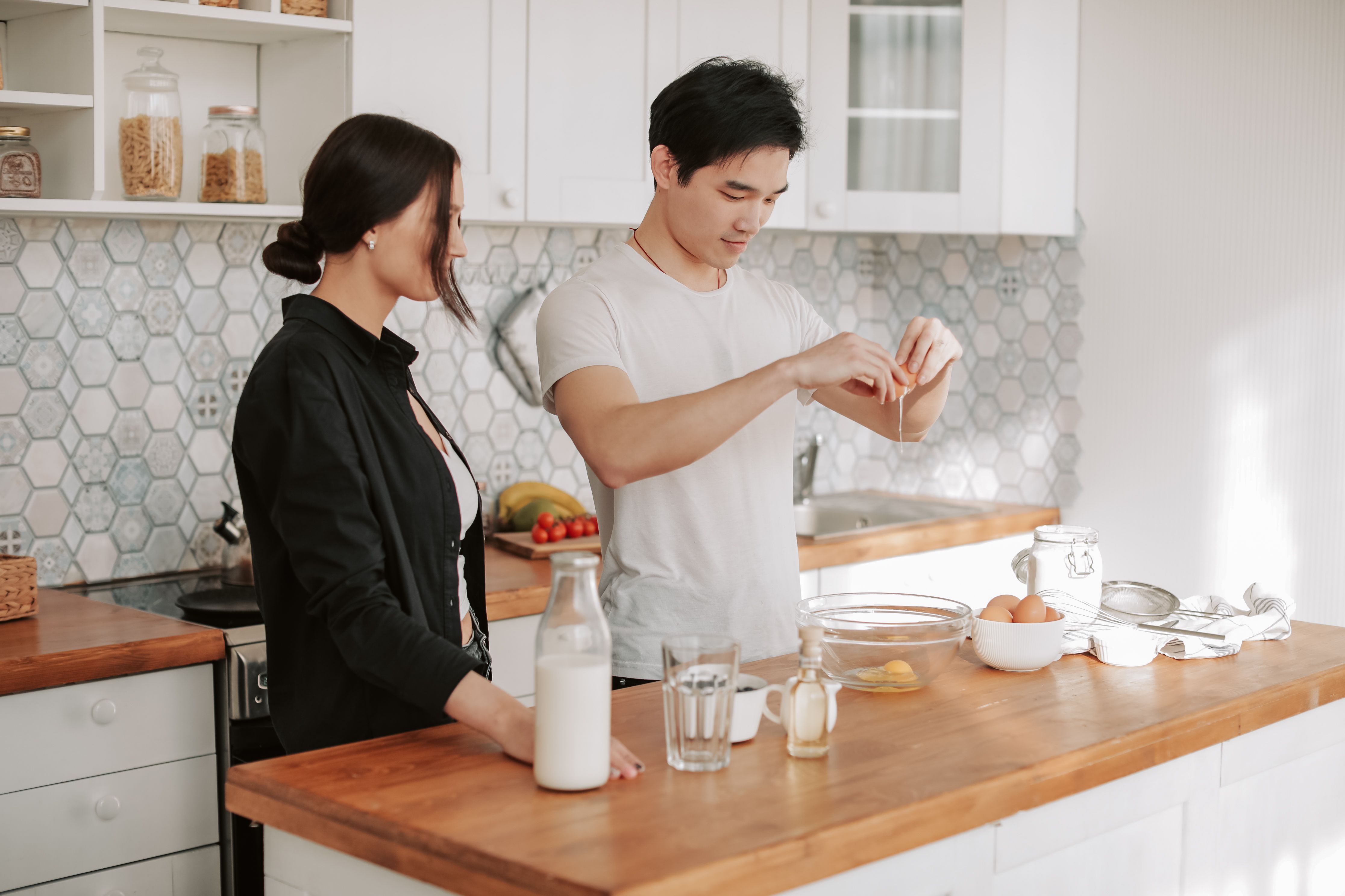 Person cooking a fresh meal in a home kitchen